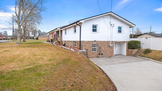 view of home's exterior with a garage and a yard