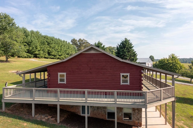 view of home's exterior with a lawn and a wooden deck