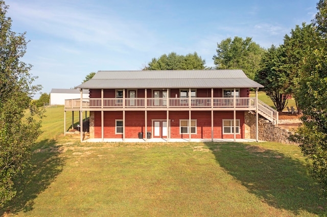 back of house with a patio area, a yard, and a wooden deck