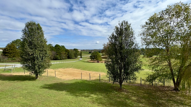 view of community featuring a yard and a rural view