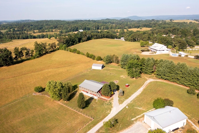 birds eye view of property with a rural view