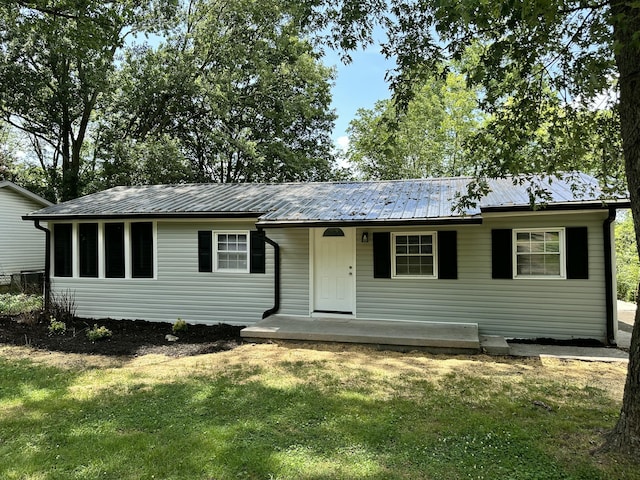 1453 Barnes St NE, Cleveland, TN 37311 - view of front of home featuring a front lawn, a metal roof, and covered porch