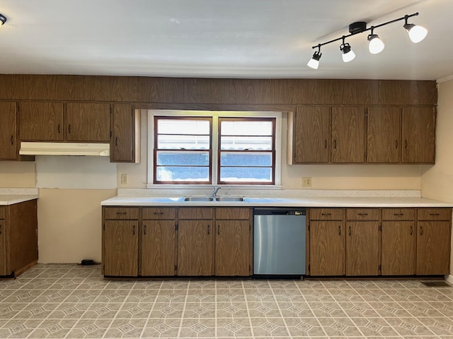 kitchen featuring track lighting, dishwasher, and sink