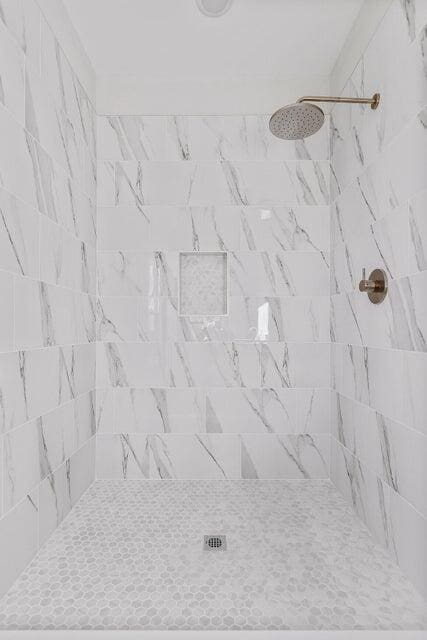 details with a tile shower