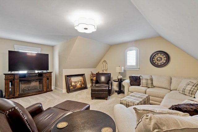 carpeted living room featuring vaulted ceiling