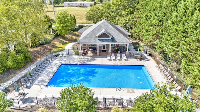 view of pool featuring an outdoor structure and a patio area