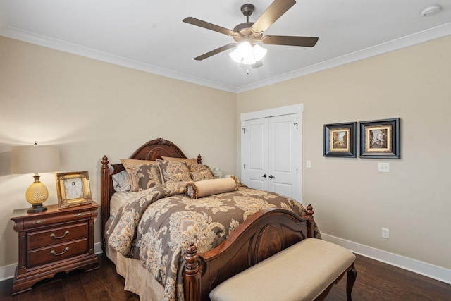 bedroom with crown molding, dark wood-type flooring, and a closet