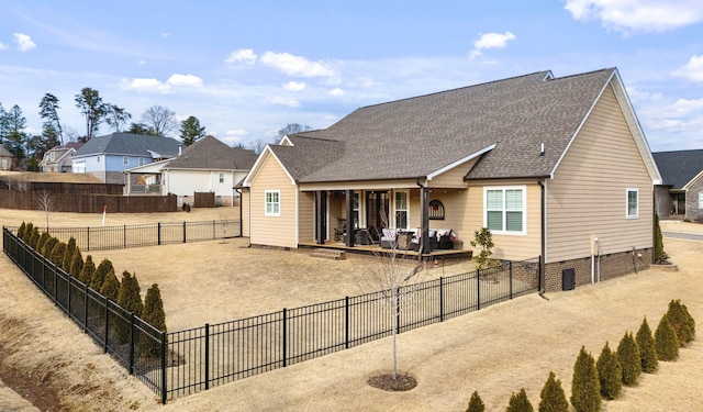 back of property with a patio