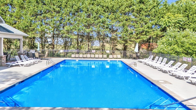 view of pool featuring a patio area