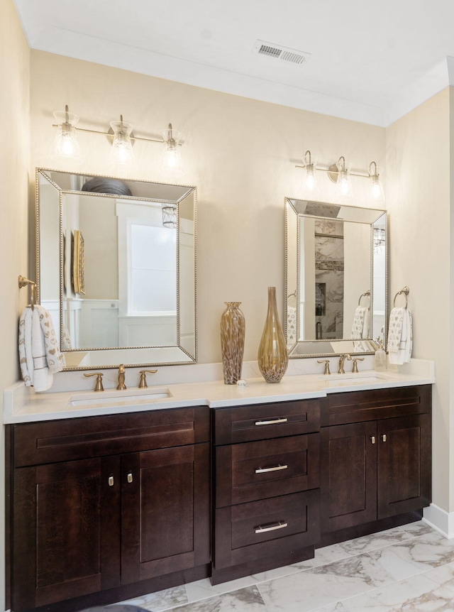 bathroom with vanity and crown molding