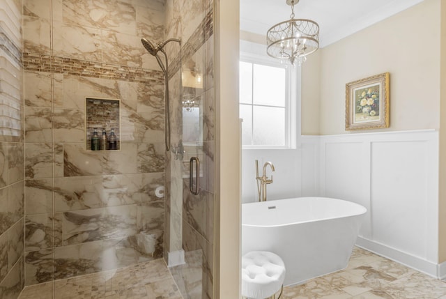 bathroom featuring ornamental molding, independent shower and bath, and a notable chandelier