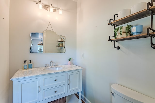 bathroom with vanity and toilet