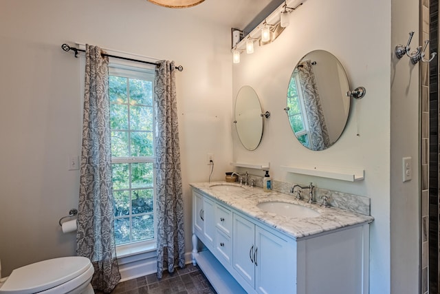 bathroom with vanity and toilet