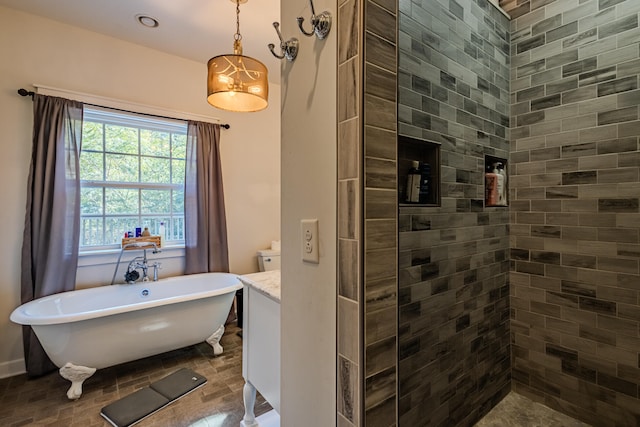 bathroom featuring vanity and a tub