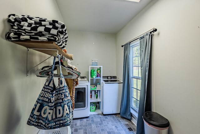 interior space with washer and clothes dryer