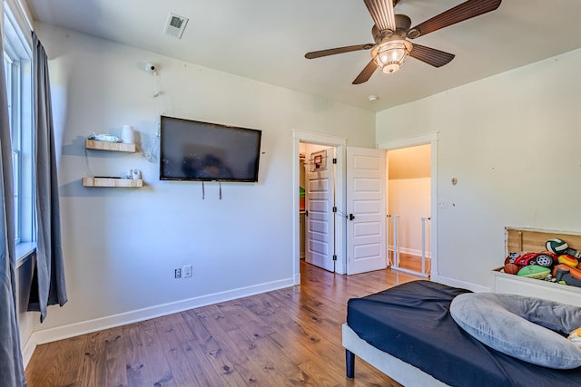 bedroom featuring wood-type flooring and ceiling fan