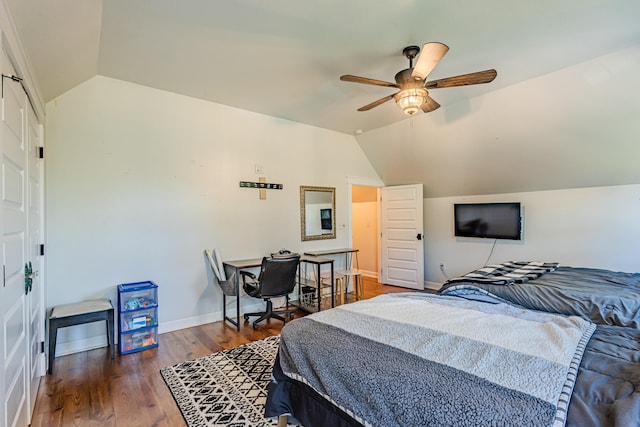 bedroom with dark wood-type flooring, ceiling fan, and vaulted ceiling