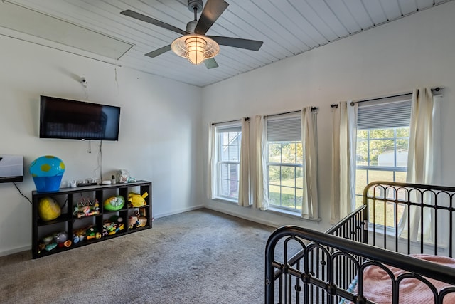 bedroom featuring multiple windows, carpet, and ceiling fan