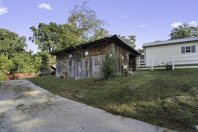 view of side of property with an outbuilding