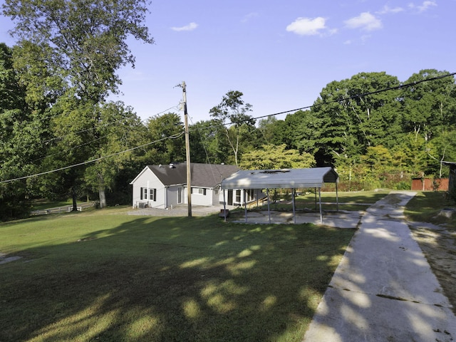 view of front of home featuring a carport and a front lawn