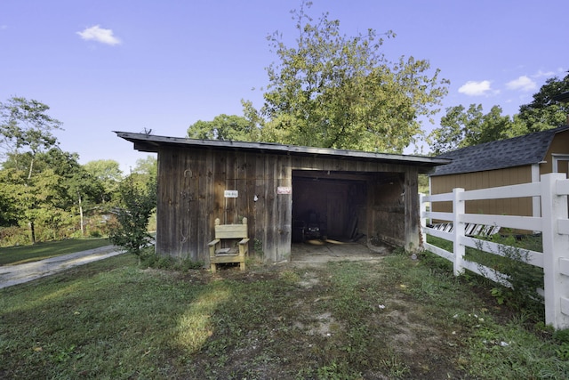 view of outbuilding with a lawn