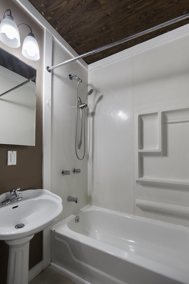 bathroom with sink, tile patterned floors, shower / bathtub combination, and wood ceiling