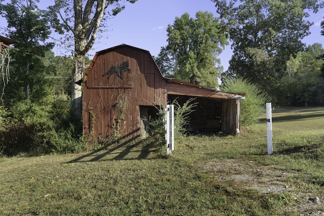 view of outbuilding featuring a yard