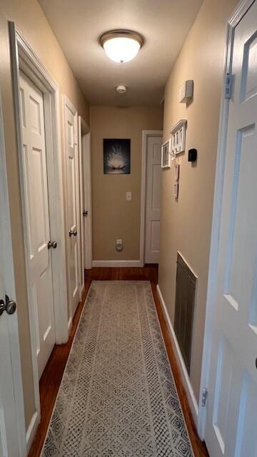 1625 Green Hill Dr, Hixson, TN 37343 - hallway with dark wood-type flooring and baseboards