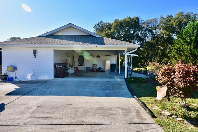 view of side of property featuring a carport