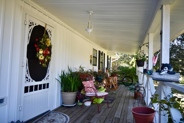 wooden terrace with a porch