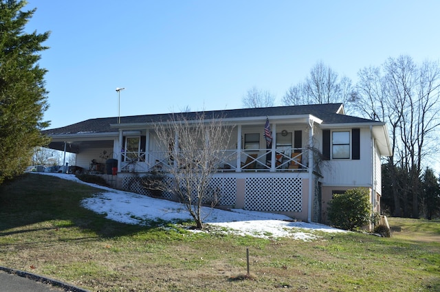 view of front of home featuring covered porch and a front yard