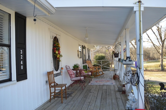 wooden terrace with a porch