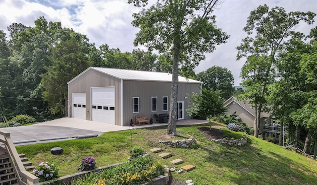 4809 Wind Bluff Cir, Birchwood, TN 37308 - view of front of property with an outbuilding, a front lawn, a garage, and metal roof