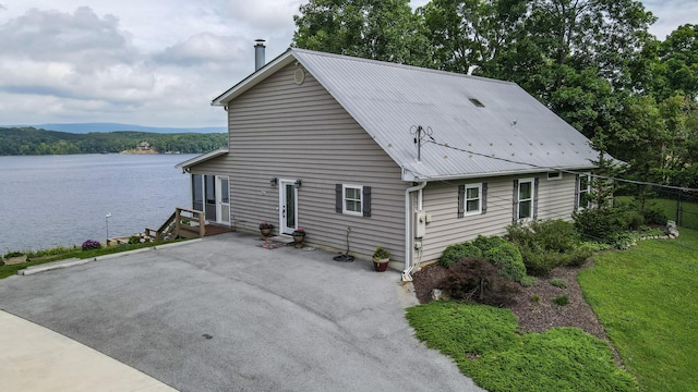 4809 Wind Bluff Cir, Birchwood, TN 37308 - view of side of property with metal roof and a water view
