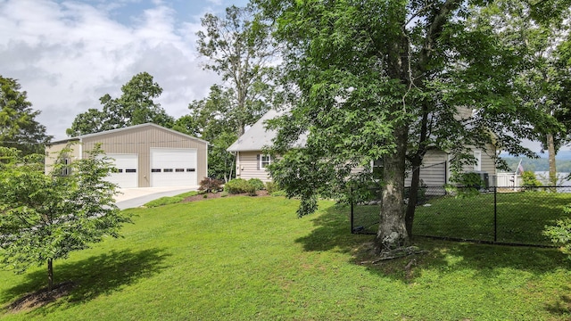 4809 Wind Bluff Cir, Birchwood, TN 37308 - view of yard featuring a detached garage, an outdoor structure, and fence