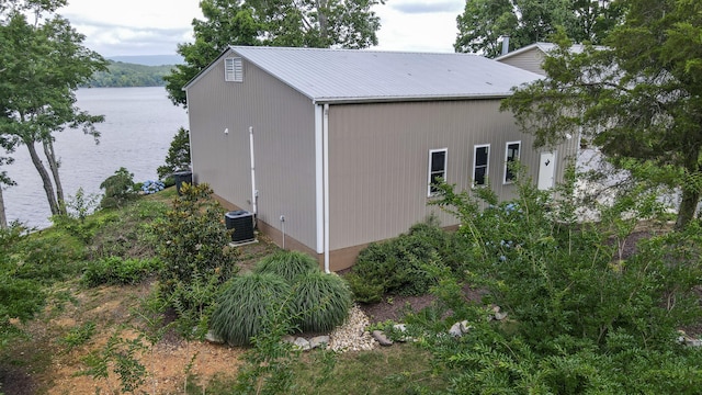 4809 Wind Bluff Cir, Birchwood, TN 37308 - view of side of home featuring central AC unit, a water view, and metal roof