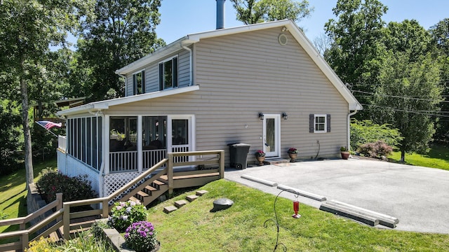 4809 Wind Bluff Cir, Birchwood, TN 37308 - rear view of house featuring a yard and a sunroom