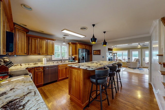 4809 Wind Bluff Cir, Birchwood, TN 37308 - kitchen with visible vents, dishwasher, a kitchen bar, black fridge with ice dispenser, and a sink