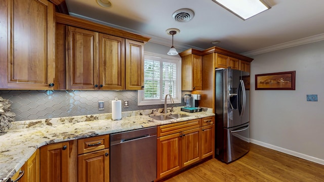 4809 Wind Bluff Cir, Birchwood, TN 37308 - kitchen with fridge with ice dispenser, visible vents, a sink, brown cabinetry, and dishwasher