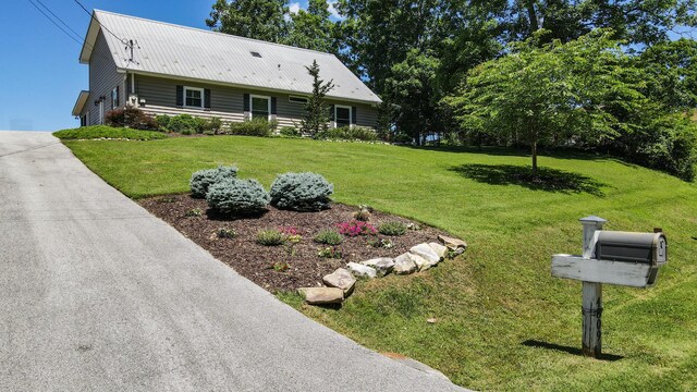 4809 Wind Bluff Cir, Birchwood, TN 37308 - view of front of house with a front lawn, a garage, and driveway