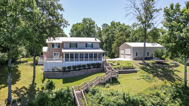 4809 Wind Bluff Cir, Birchwood, TN 37308 - back of property featuring stairway, an outbuilding, a yard, and a sunroom