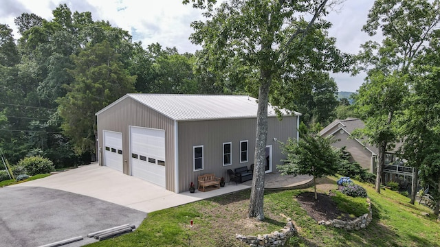 4809 Wind Bluff Cir, Birchwood, TN 37308 - view of front facade featuring a detached garage, an outdoor structure, and metal roof