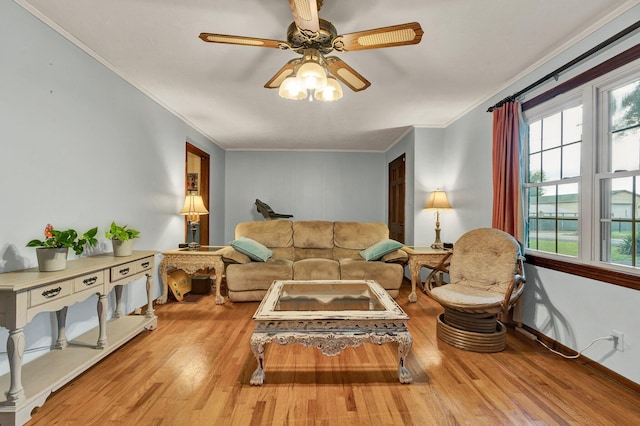 141 Church St, Calhoun, TN 37309 - living area featuring ornamental molding, wood finished floors, ceiling fan, and baseboards