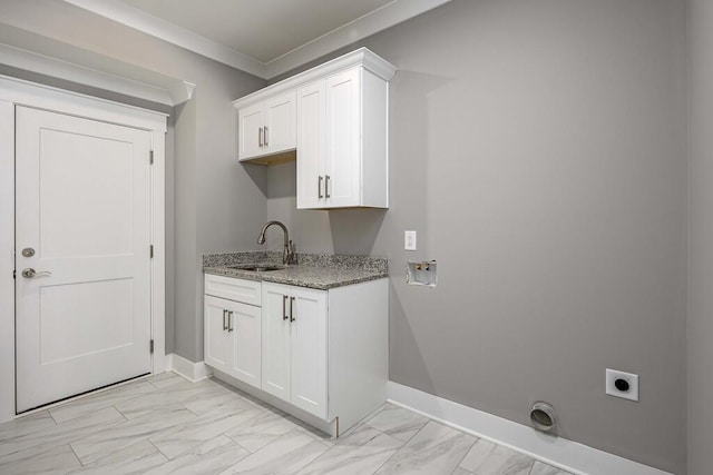 washroom featuring sink, cabinets, ornamental molding, hookup for a washing machine, and hookup for an electric dryer