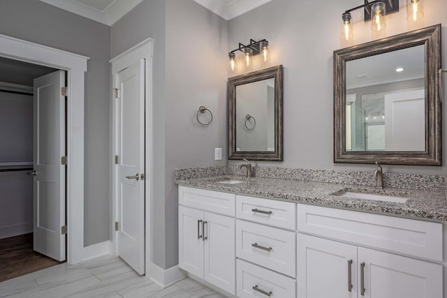 bathroom featuring vanity and crown molding