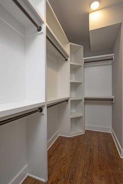 walk in closet featuring dark hardwood / wood-style floors