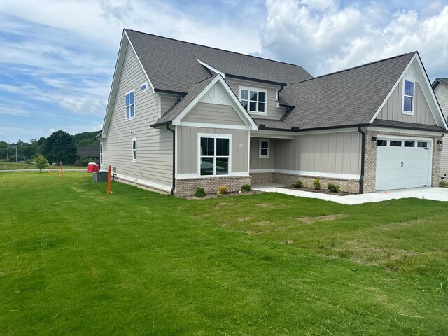 222 Arthur Ln NW, Cleveland, TN 37312 - craftsman inspired home with cooling unit, a garage, and a front yard