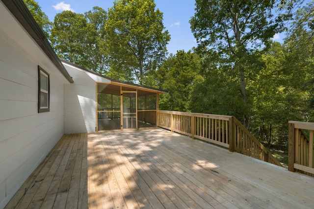 deck with a sunroom
