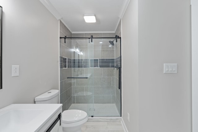 full bathroom with toilet, a stall shower, ornamental molding, and vanity