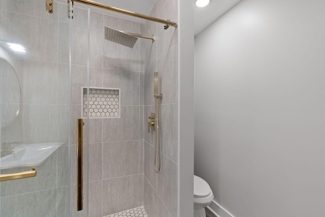full bathroom with toilet and a shower stall